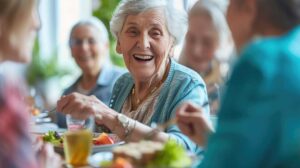Older adults painting and arranging flowers together at a bright assisted living activity table.